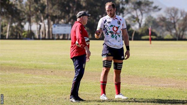 Alun Wyn Jones talking to Neil Jenkins in training