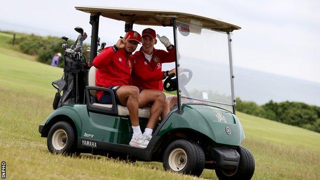 Anthony Watson and Liam Williams on a golf buggy