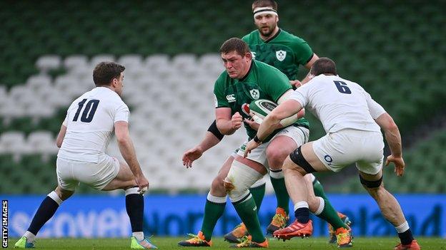 Tadhg Furlong runs with the ball against England