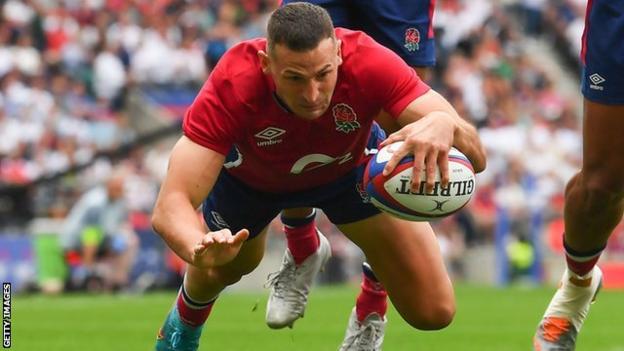 Jonny May dives to score