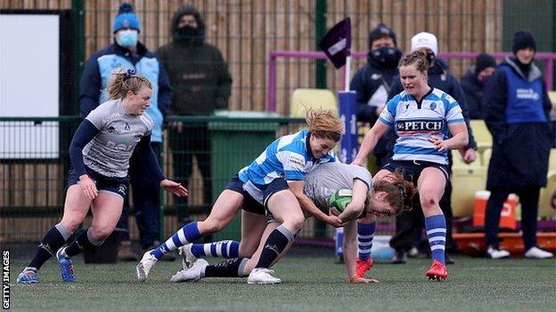 Lisa Neumann is tackled