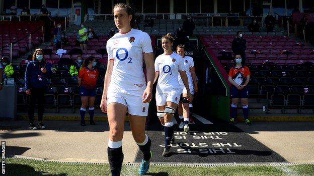 Emily Scarratt leads out the England team