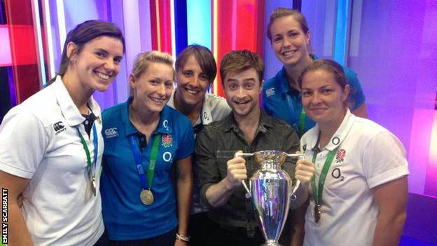 England players with the World Cup trophy and Daniel Radcliffe