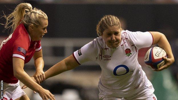 England's Poppy Cleall runs with the ball