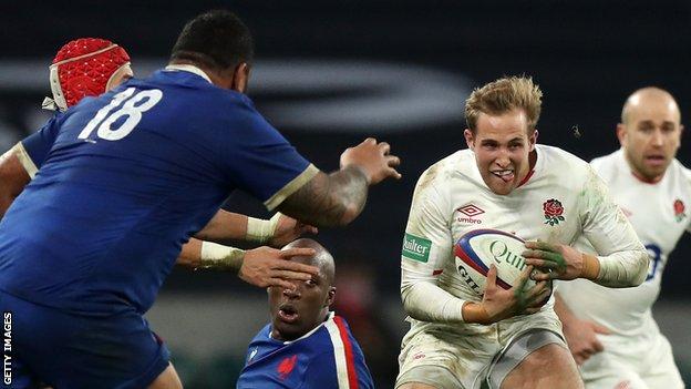 Max Malins runs with the ball against France