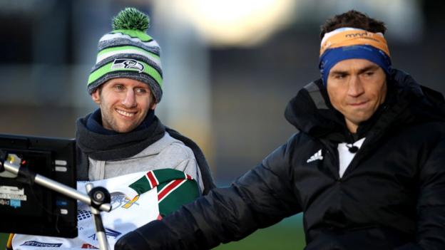 Ex-Leeds Rhinos rugby league player Kevin Sinfield (Right) embraces former team-mate Rob Burrow after completing his Extra Mile Challenge at Headingley Stadium