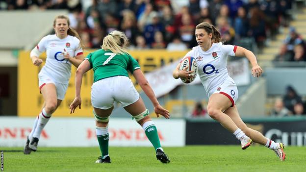 England's Helena Rowland runs with the ball against Ireland